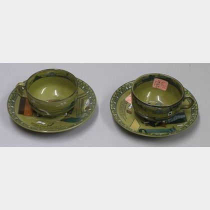 Two Buffalo Pottery Emerald Deldare Ware "Dr. Syntax and Bookseller" Saucers and a Pair of Deldare Ware Cups