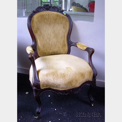 Victorian Rococo Revival Upholstered Carved Walnut Parlor Armchair. 
