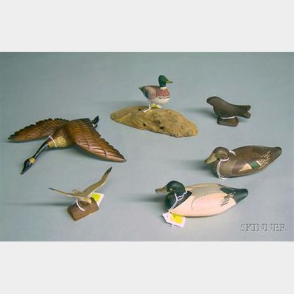 Five Carved and Painted Small Bird and Fowl Figures and a Cast Iron Bird