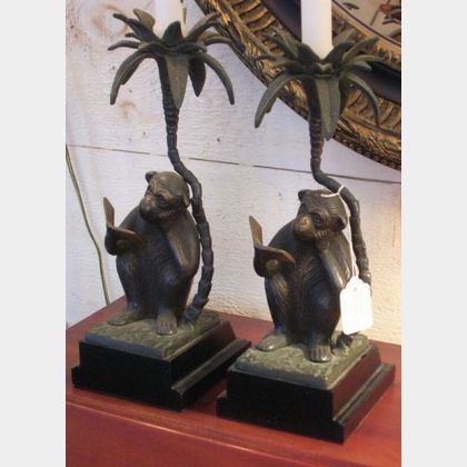 Pair of Patinated Bronze Seated Monkey Reading a Book Figural Candlesticks with Ebonized Metal Base