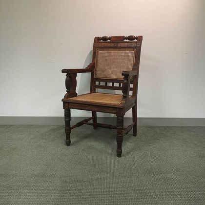 Renaissance Revival Caned and Carved Oak Armchair