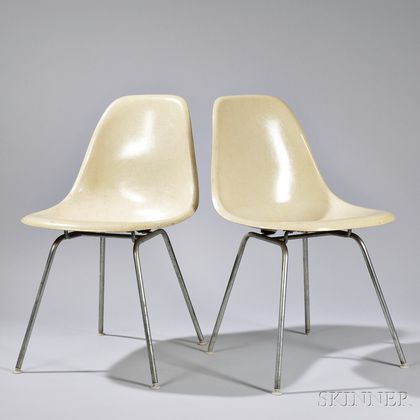 Two Shell Chairs by Charles and Ray Eames, manufactured by Herman Miller, Zeeland, Michigan, molded fiberglass and tubular steel, ivory