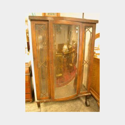 Oak China Cabinet with Bowed Glass Door. 