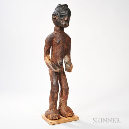 Carved Figure of a Standing Blindfolded Man