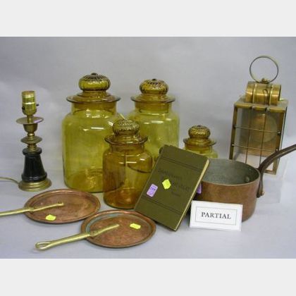 Seven Copper Pans with Iron Handles, a Set of Five Amber Glass Jars, Two Brass Lanterns, a Small Brass Table Lamp. 