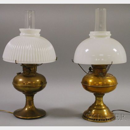 Two Brass Kerosene Table Lamps with Milk Glass Dome Shades, Three Rustic Wooden Rakes and a Saw