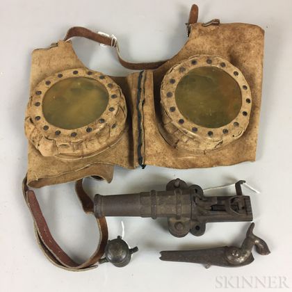 Pair of Reproduction WWI Hide Horse Goggles and Three Small Cannons. Estimate $10-20