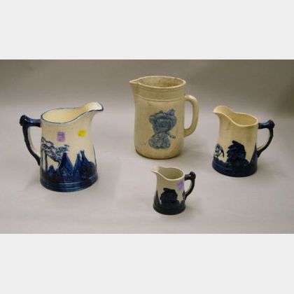 Set of Three Graduated Cobalt Highlighted Native American Motif Decorated Stoneware Pitchers and a Profile Deco... 