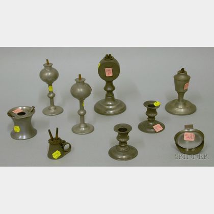 Eight Early Pewter Lighting Devices
