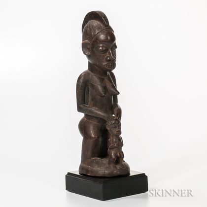 West African Carved Wood Female Figure with Child