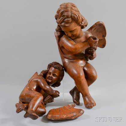 Two Continental Carved Walnut Putti