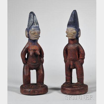 Two Pairs of Carved Wooden Ibeji Dolls