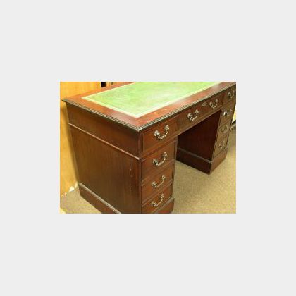 Mahogany Leather Inset Flat-top Double-Pedestal Desk. 