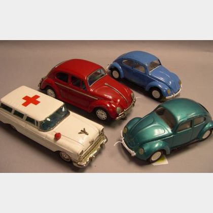 Two Tonka Painted Pressed Metal Volkswagen Beetles, a Painted Pressed Metal Battery Powered Volkswagen Beetle, and a Japanese Painted P