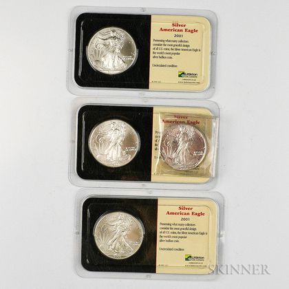 1988 and Three 2001 American Silver Eagles. Estimate $80-100