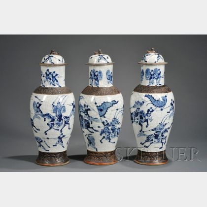 Three Blue and White Tall Jars and Covers