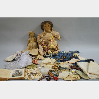 Four Dolls with an Assortment of Doll Clothes and Child's Animal Book
