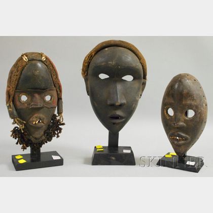Three Carved Wooden Dan Masks