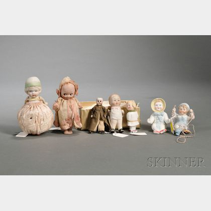 Four Small All-Bisque Dolls and Three Small Bisque Figures