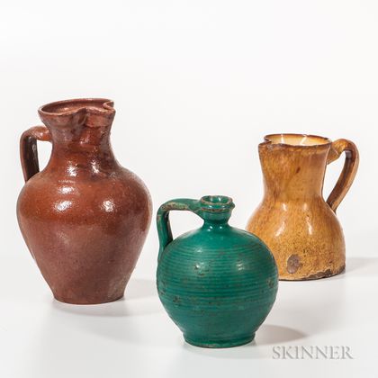 Two Redware Pitchers and a Green-glazed Jug