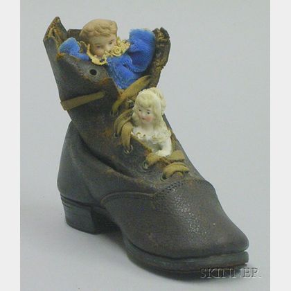 Two Bisque Figures in Leather Shoe, 