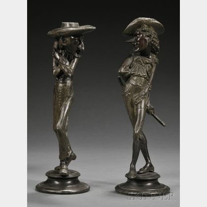 Pair of Patinated Metal Figural Candlesticks
