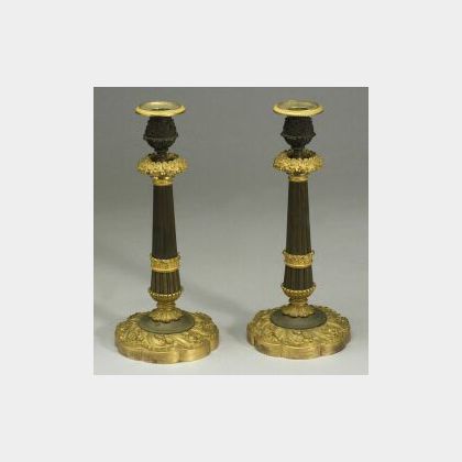 Pair of Louis XVI-style Parcel Gilt Ormolu Candlesticks