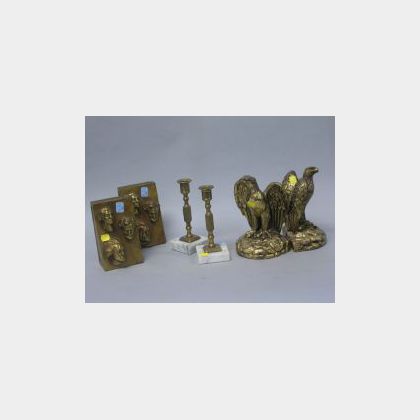 Two Pairs of Gilt-metal Patriotic Bookends and a Pair of Brass Candlesticks