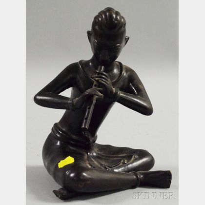 Asian Patinated Bronze Figure of a Seated Flute Player