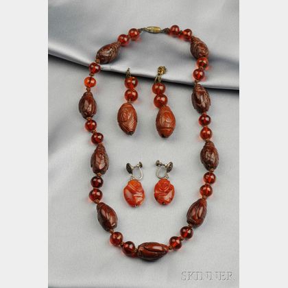 Cherry Amber and Carved Figural Bead Necklace