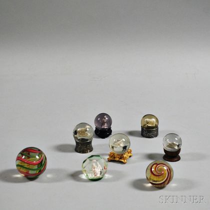 Eight Mostly Colorless Glass Marbles