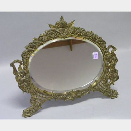 Oval Victorian Cast Brass Angels Decorated Table Mirror with Beveled Glass. 