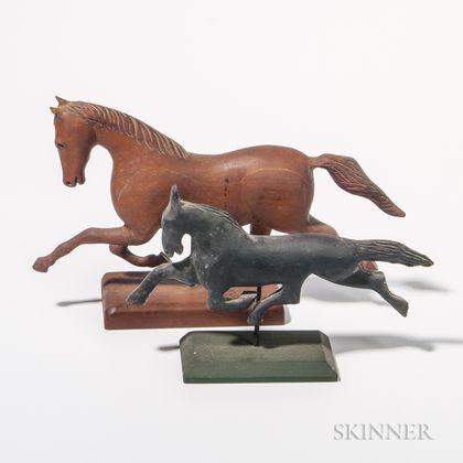 Two Carved Trotting Horses