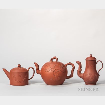 Three Red Stoneware Teapots and Covers