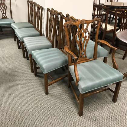 Set of Fourteen Chippendale-style Carved and Upholstered Mahogany Dining Chairs. Estimate $800-1,200