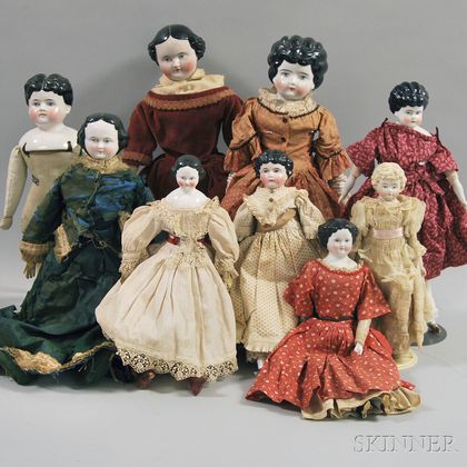 Nine Mostly Black-haired China Head Dolls