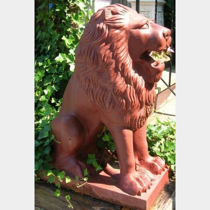 Pair of Red Painted Cast Iron Seated Lion Ornaments