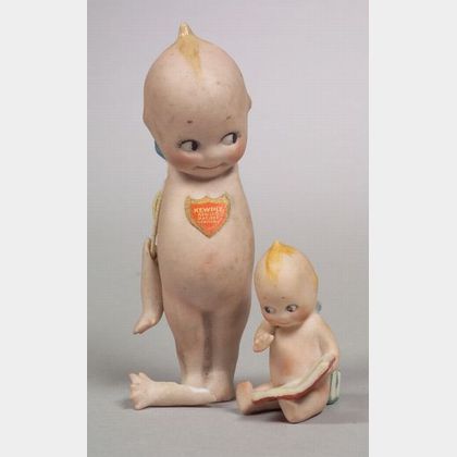 Small Seated Kewpie Reading a Book and Standing Kewpie