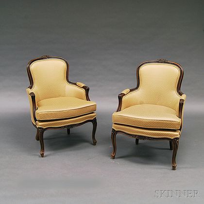 Pair of French Provincial-style Carved Fruitwood Bergeres