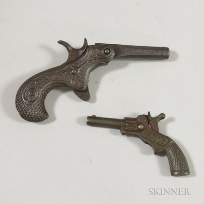 Two Climax and Pluck Cast Iron Cap Guns
