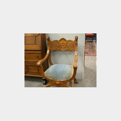 Late Victorian Northwind Carved Golden Oak X-form Armchair. 