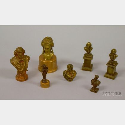Six Small Classical and Historical Bronze Busts and a Cherub Figural Seal