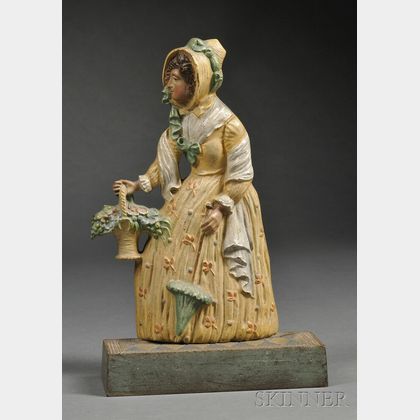 Polychrome-painted Cast Iron Lady with Basket of Flowers Doorstop