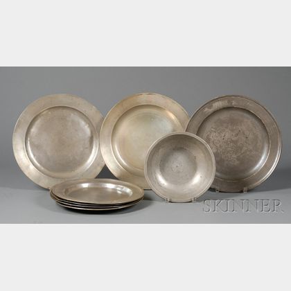 Seven Large Pewter Plates and a Basin