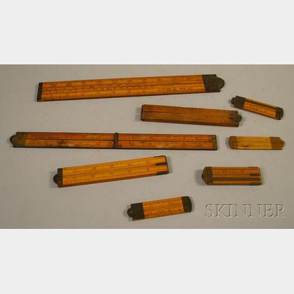 Eight Folding Wooden Rulers