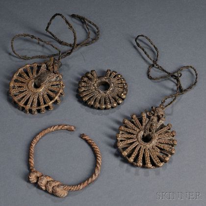 Three Dogon Brass Sunburst Pendants and a Forged Iron Bracelet