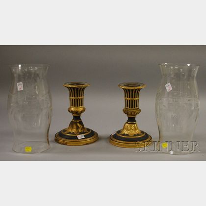 Pair of Italian Neoclassical-style Gilt and Black-painted Porcelain Candlesticks with a Near Pair of Grapevine Etched Colorless Glas...