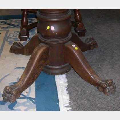 Early 20th Century Carved Oak Pedestal Paw-foot Dining Table. 