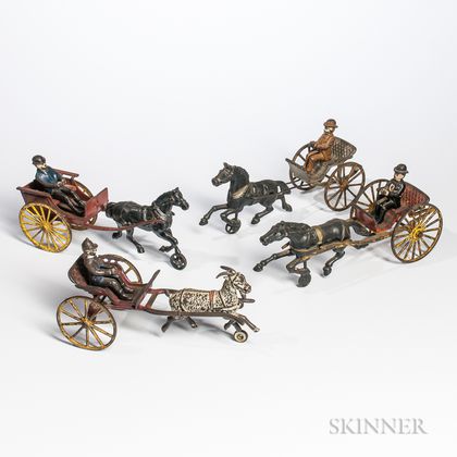 Four Cast Iron Cart and Driver Pull Toys