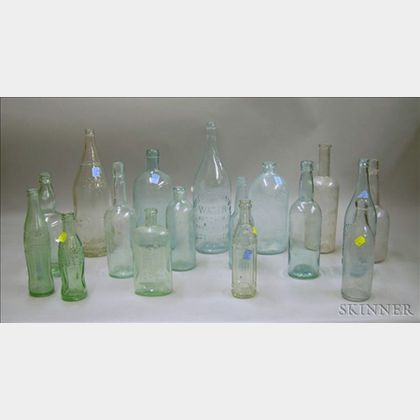 Sixteen Colorless and Aqua Glass Beverage and Spring Water Bottles
